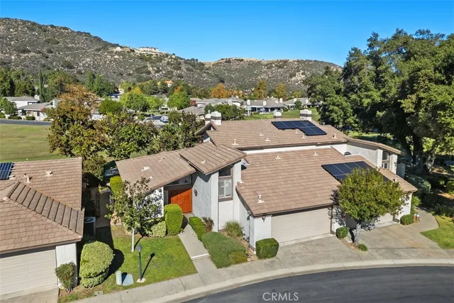 an aerial view of a house with a garden