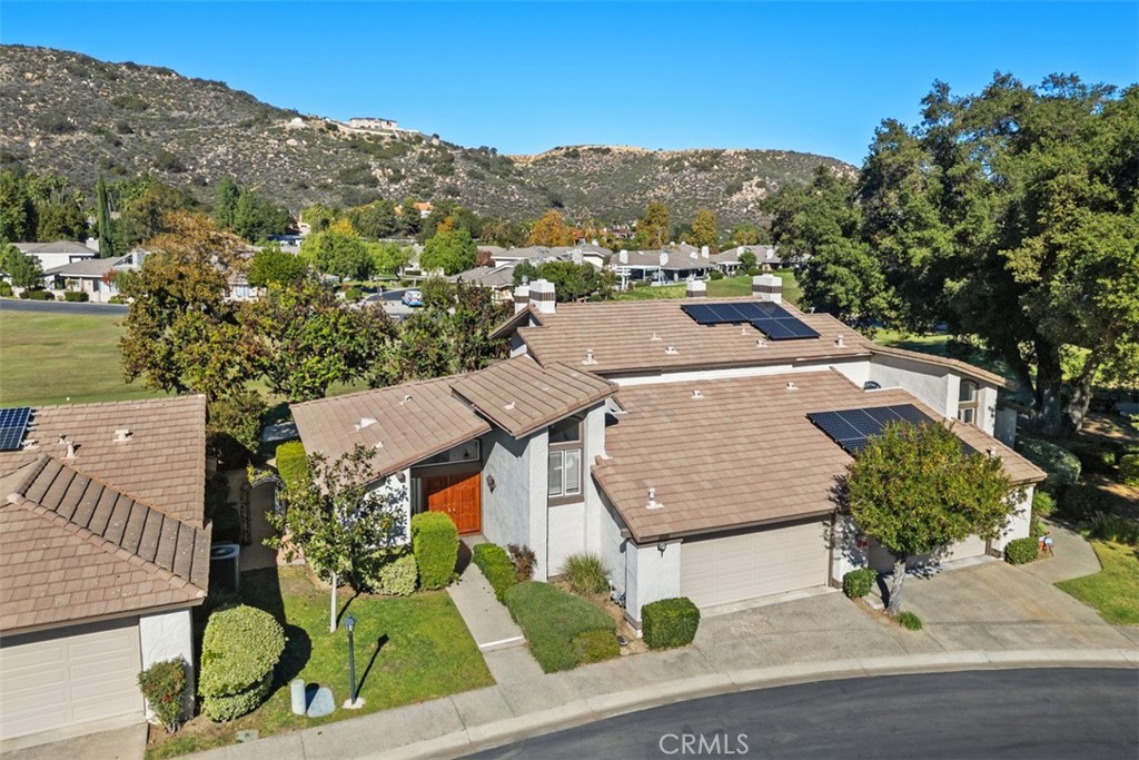an aerial view of a house with a garden