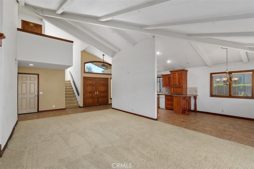38285 Oaktree Loop Murrieta, CA 92562 - Photo 11 of 39 a view of a livingroom with an empty space and a window