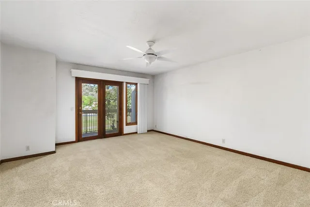 a view of empty room with a fireplace