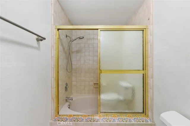 an empty room with a ceiling fan and a window