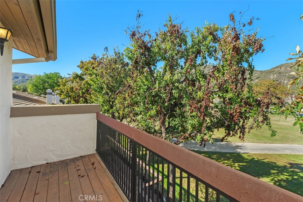 38285 Oaktree Loop Murrieta, CA 92562 - Photo 28 of 39 a view of a balcony with wooden fence