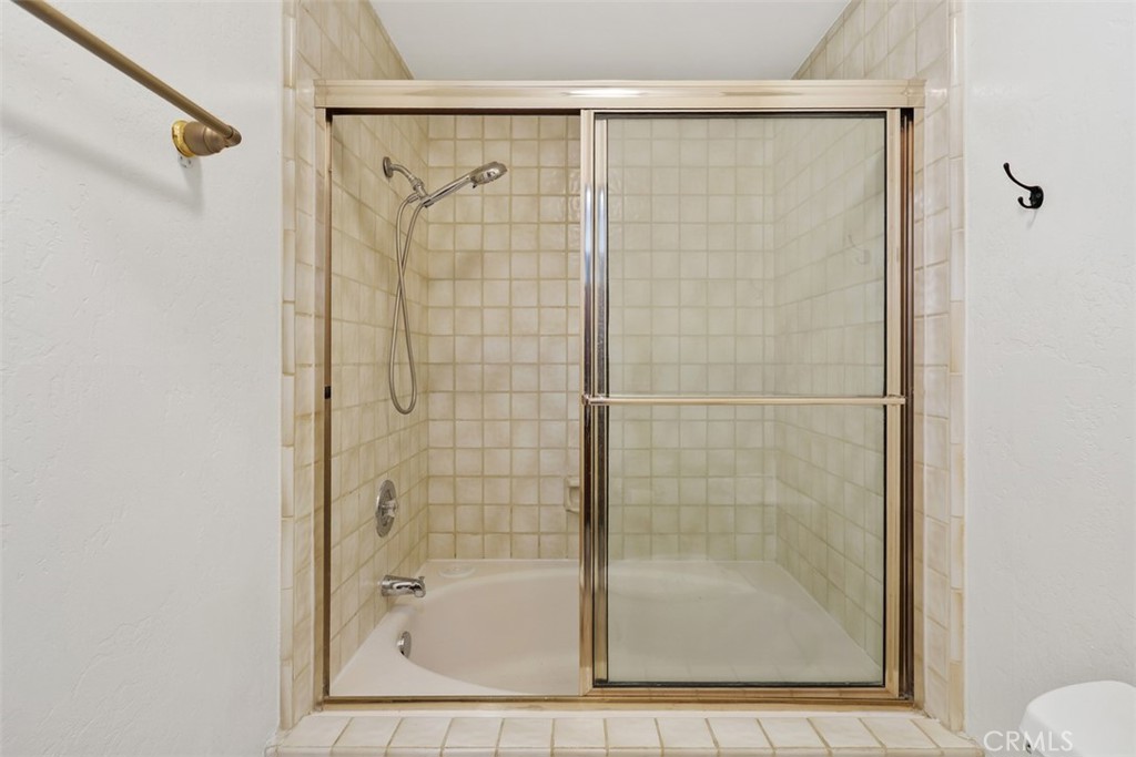 38285 Oaktree Loop Murrieta, CA 92562 - Photo 31 of 39 a bathroom with a shower