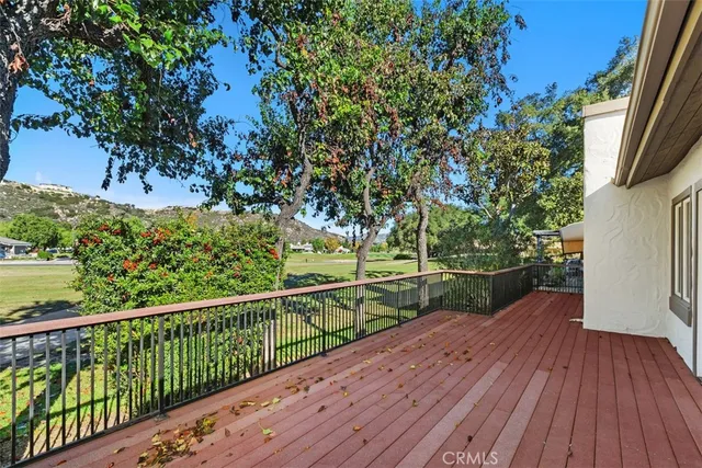 a view of a balcony with wooden floor