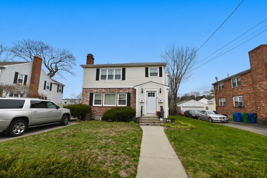 44-42 Farquhar Road, Unit 1 Newton, MA 02460 - Photo 11 of 11 a house view with a garden space