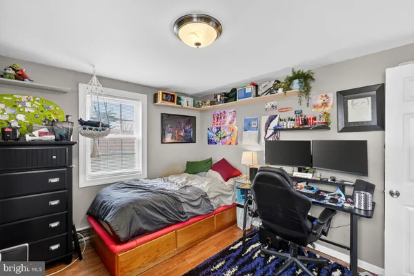 a bedroom with a bed and a bookshelf