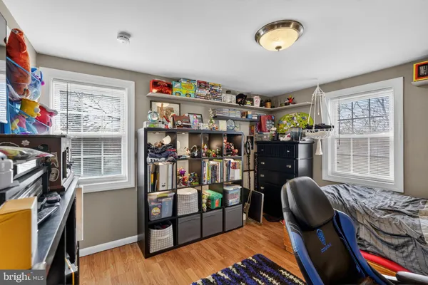 a bedroom with furniture and a window