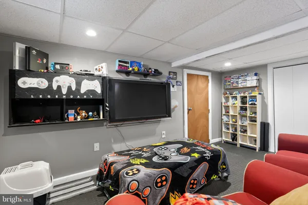 a bedroom with furniture and a flat screen tv