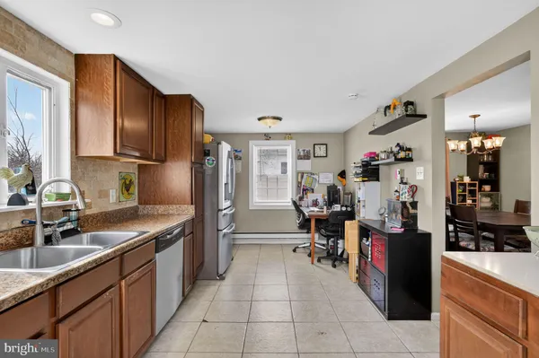 a kitchen with refrigerator and cabinets