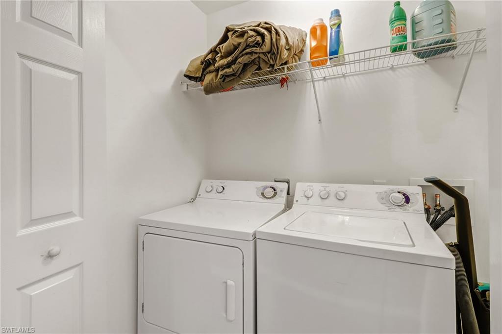 977 Hampton Circle, Unit 118 Naples, FL 34105 - Photo 19 of 24 a utility room with dryer and washer