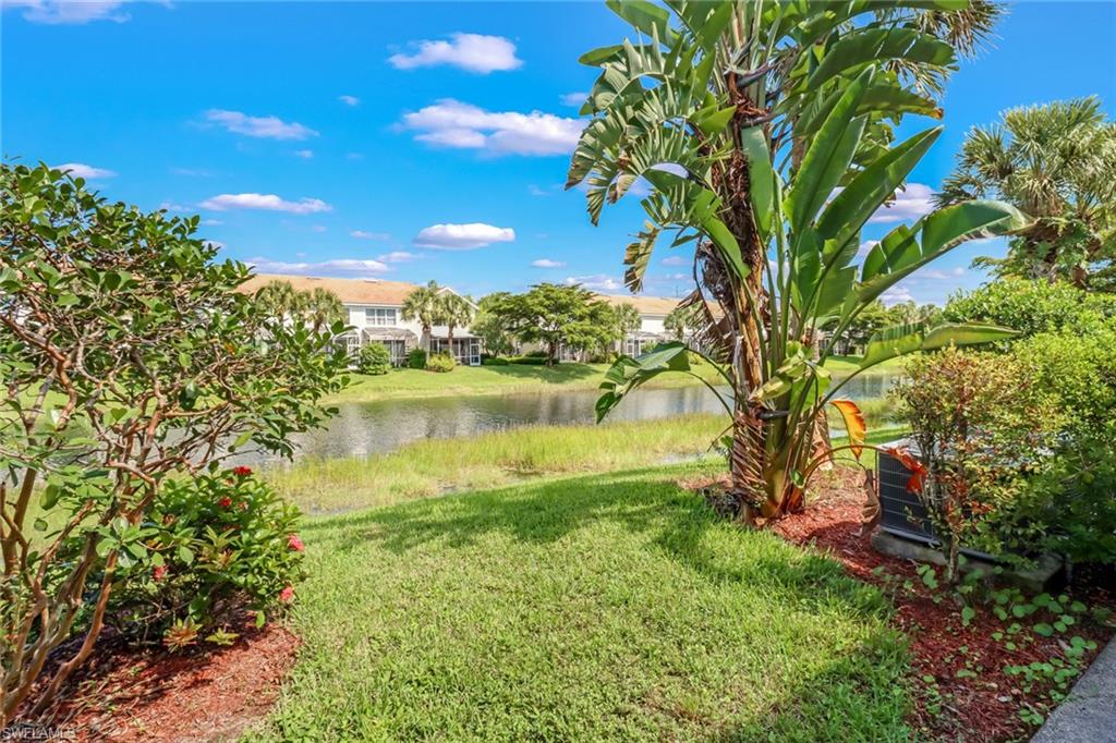 977 Hampton Circle, Unit 118 Naples, FL 34105 - Photo 22 of 24 a view of lake with houses