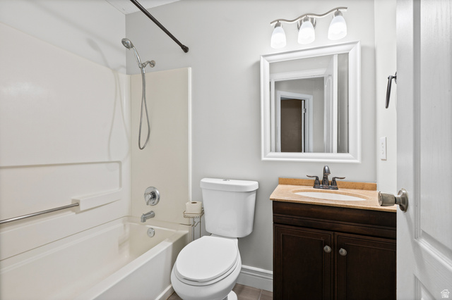 1346 Archmore Drive Springville, UT 84663 - Photo 21 of 32 Bathroom featuring a single vanity with a light-colored countertop, a framed mirror, and a three-light fixture