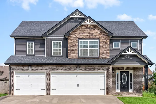 a front view of a house with a yard