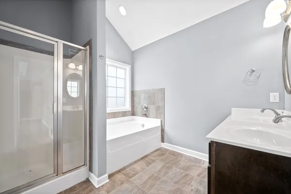 a bathroom with a bathtub and a sink