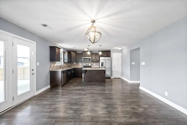 a view of kitchen with wooden floor