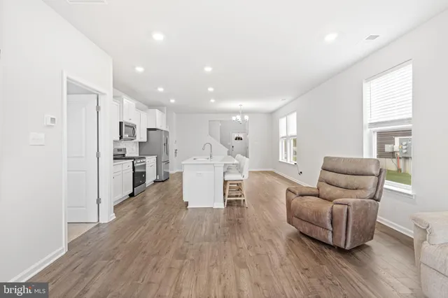 a living room with furniture and a table