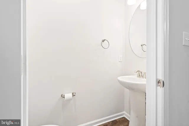 a bathroom with a sink a mirror and shower