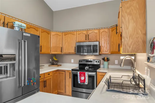 a view of a dining room with furniture wooden floor and chandelier