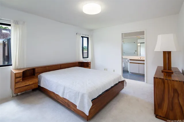 a bedroom with a bed and dresser