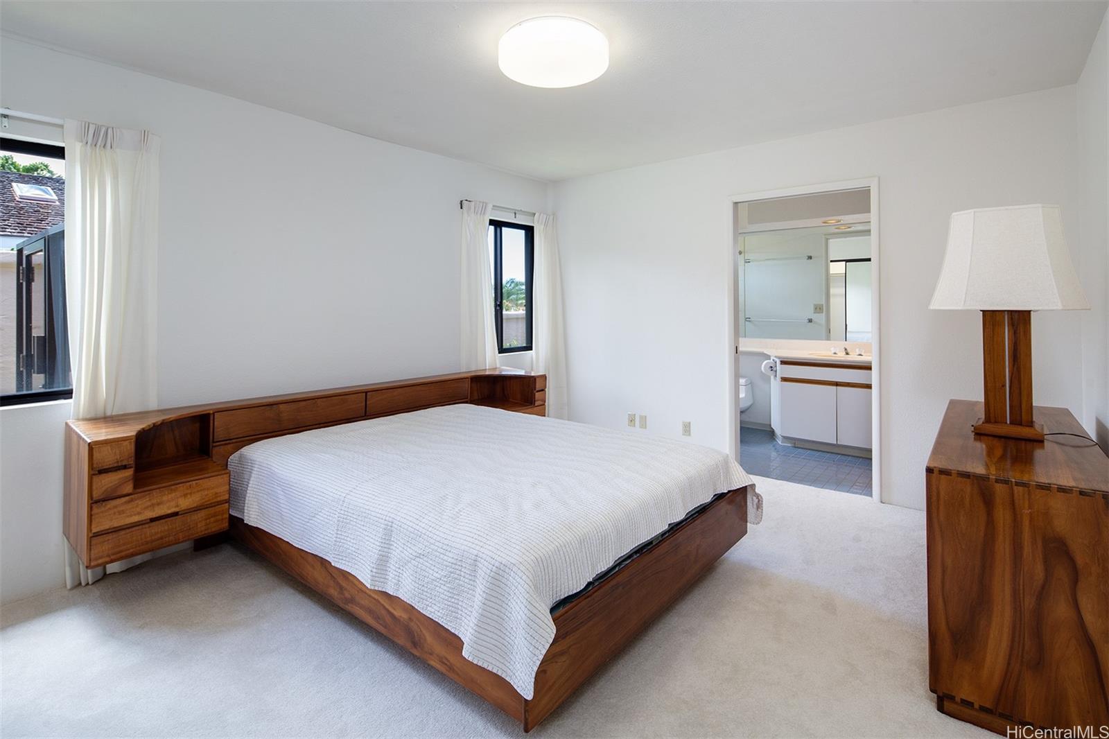 154 Maono Place Honolulu, HI 96821 - Photo 19 of 25 a bedroom with a bed and dresser