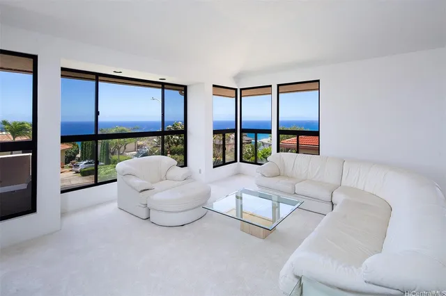 a living room with furniture or couch and a large window