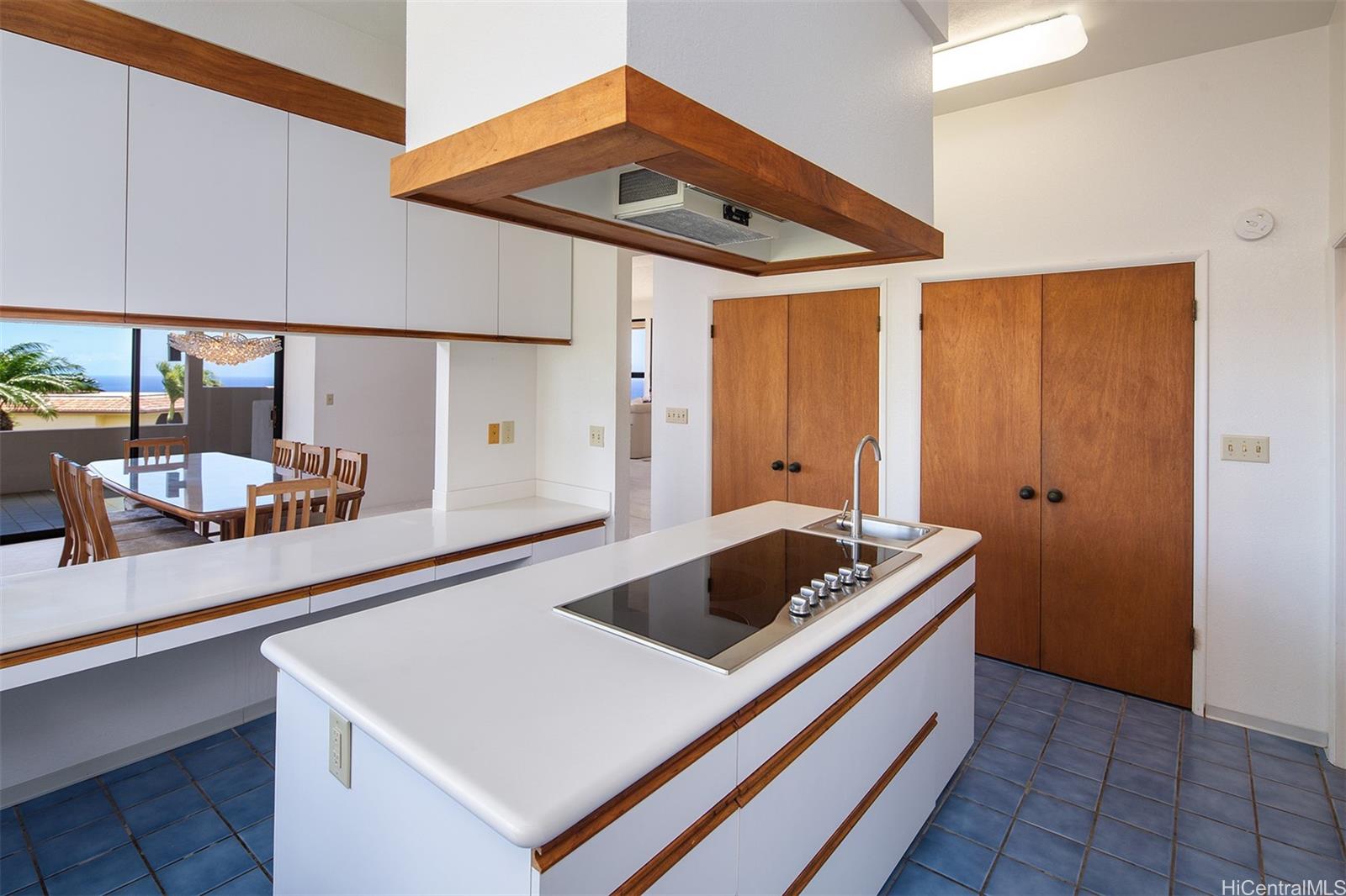 154 Maono Place Honolulu, HI 96821 - Photo 7 of 25 a kitchen that has a sink and a stove in it