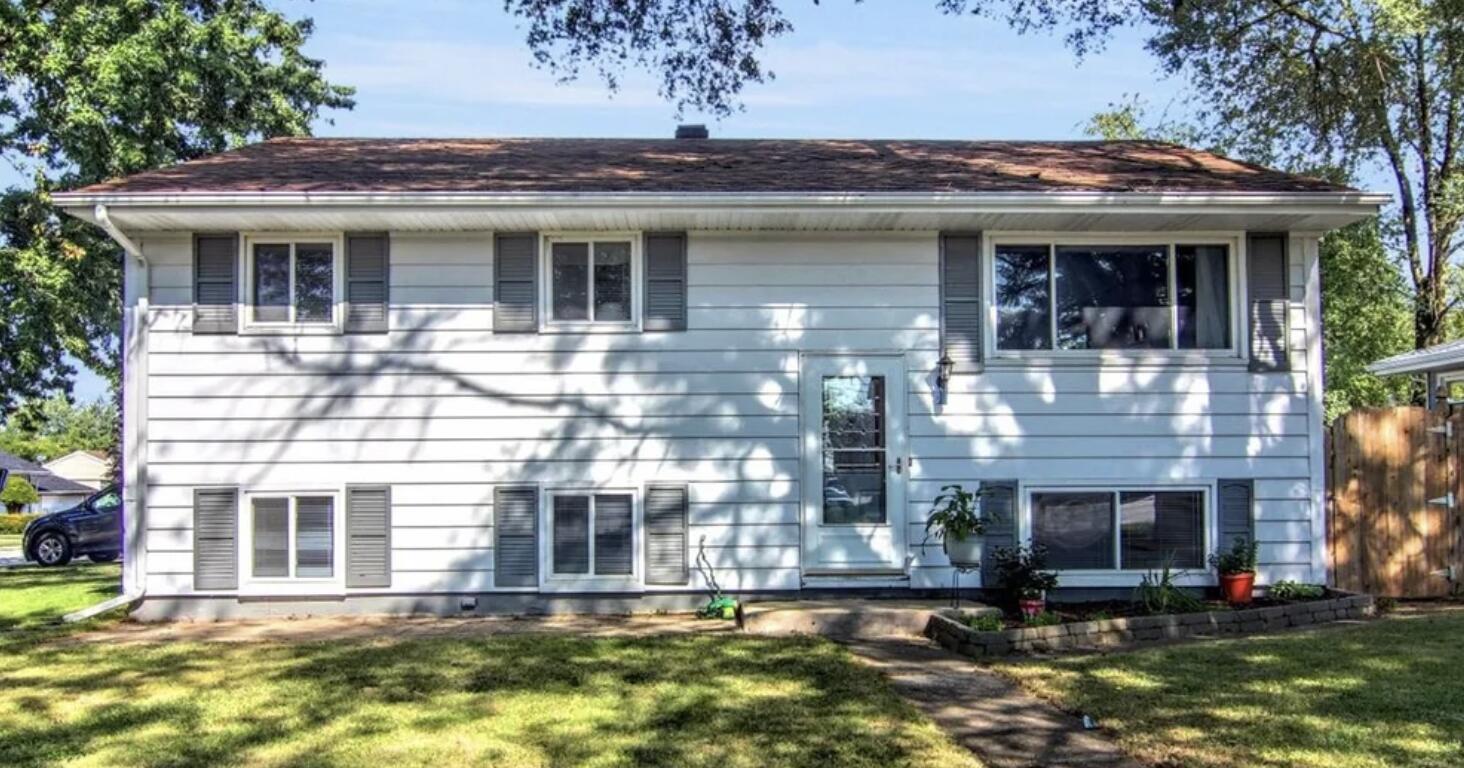 a view of a house with couches in front of house