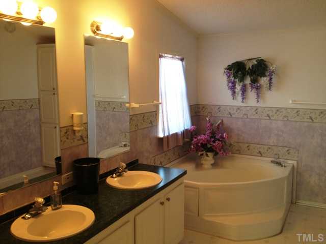 2501 Ridge Run Lillington, NC 27546 - Photo 9 of 13 Huge bath and walk in closet. 4ft shower with seat and garden tub.
