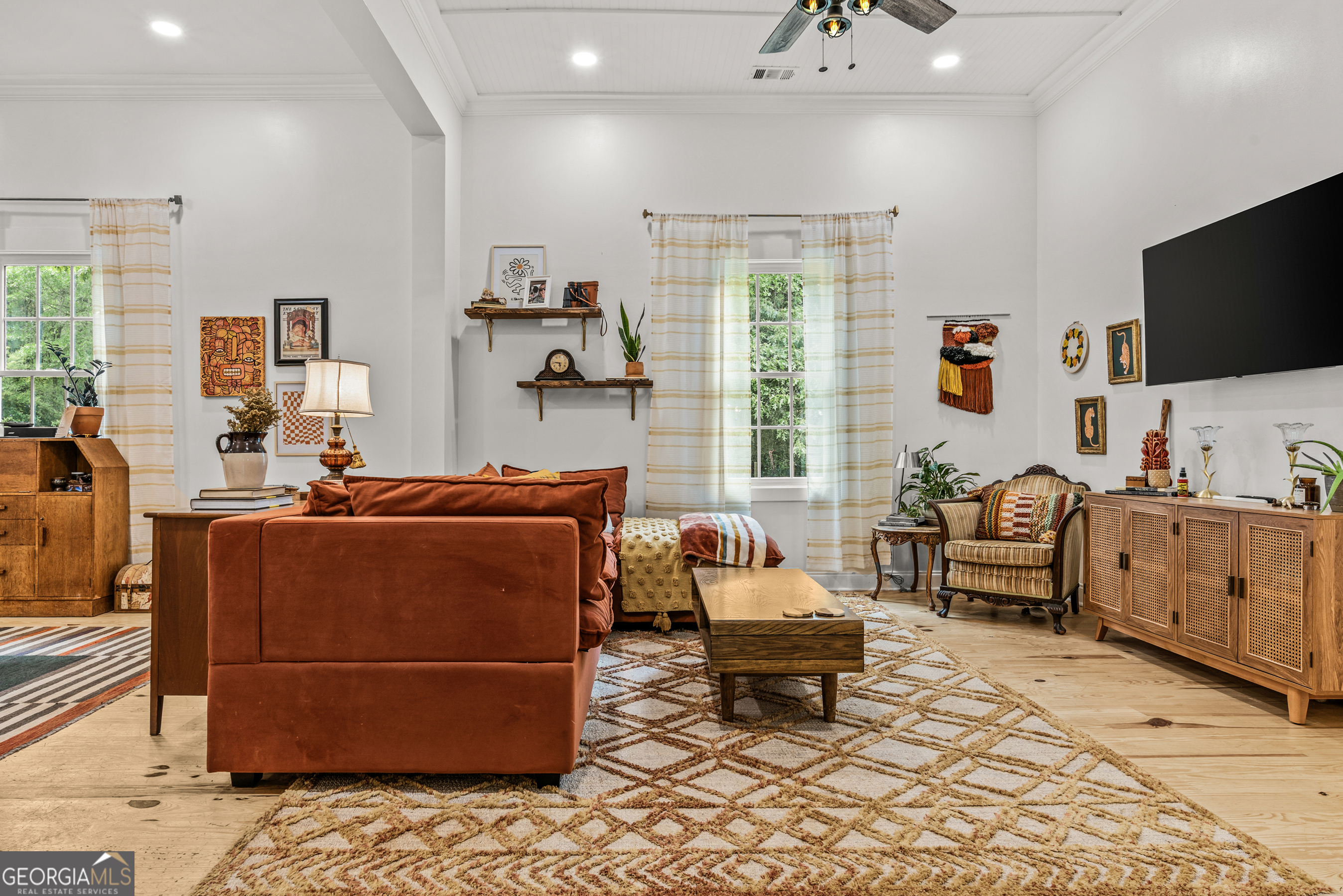 1580 Farmington Road Madison, GA 30650 - Photo 12 of 52 a living room with furniture and a flat screen tv