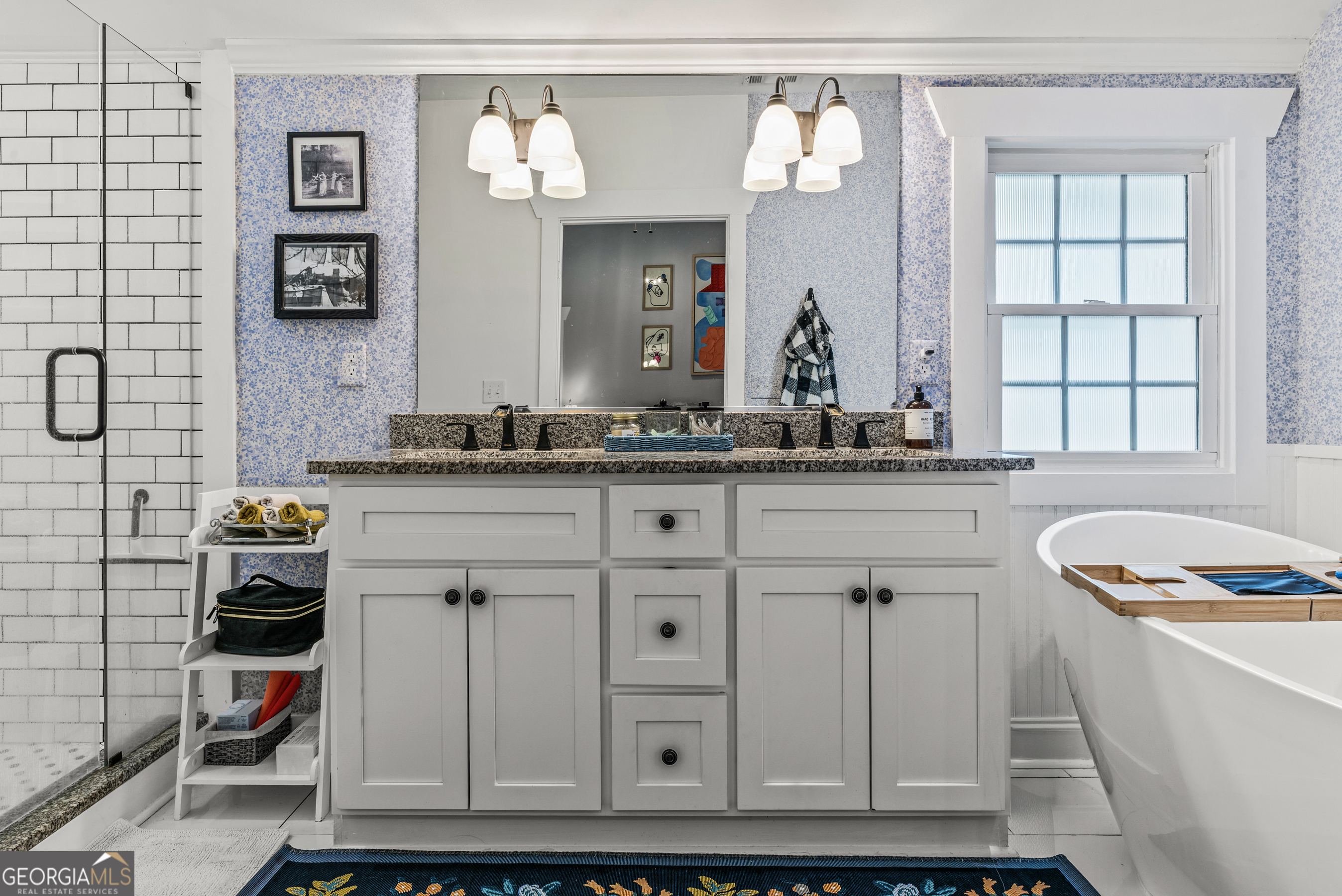 1580 Farmington Road Madison, GA 30650 - Photo 22 of 52 a bathroom with a sink and a mirror