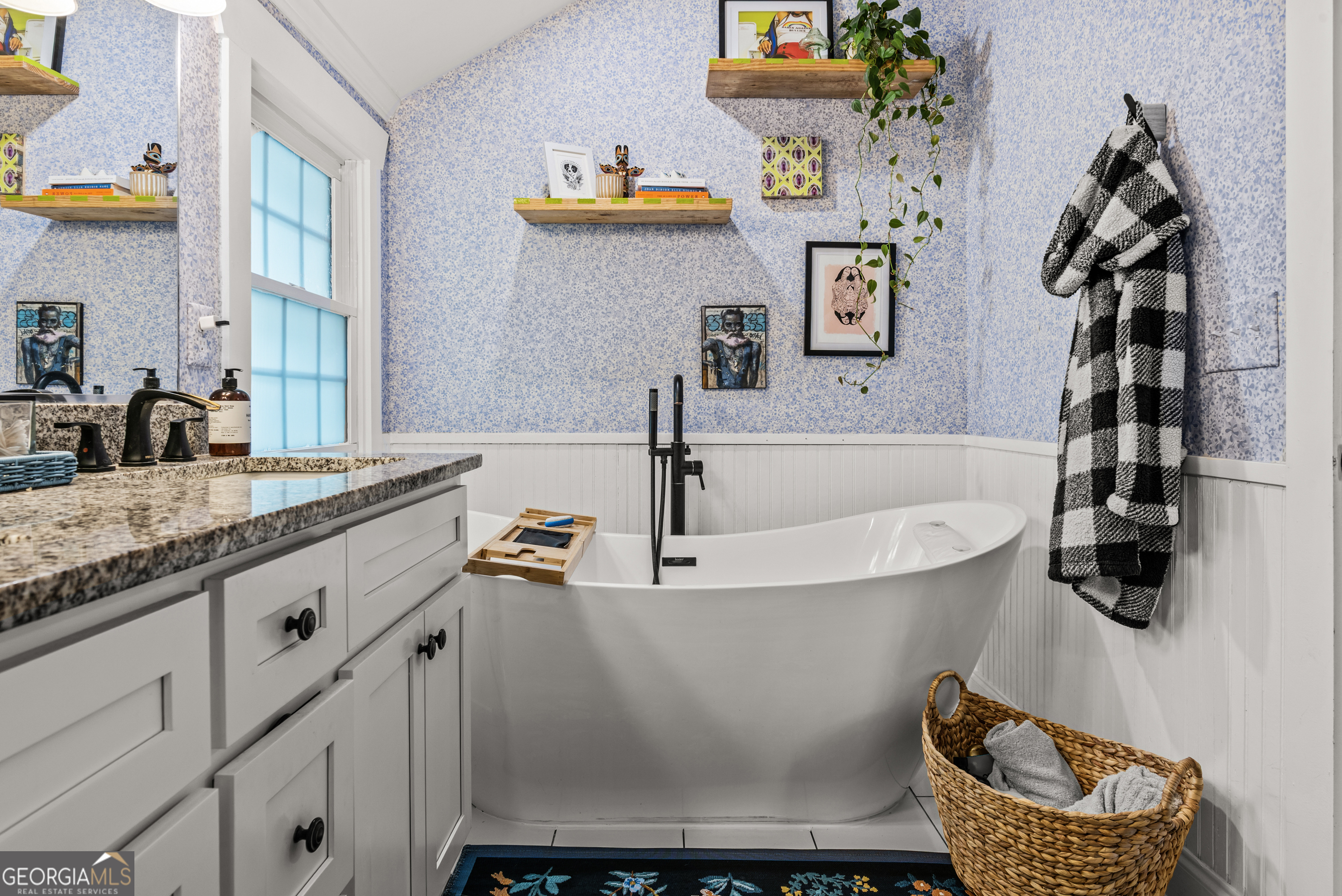 1580 Farmington Road Madison, GA 30650 - Photo 23 of 52 a bathroom with a granite countertop sink a mirror and shower