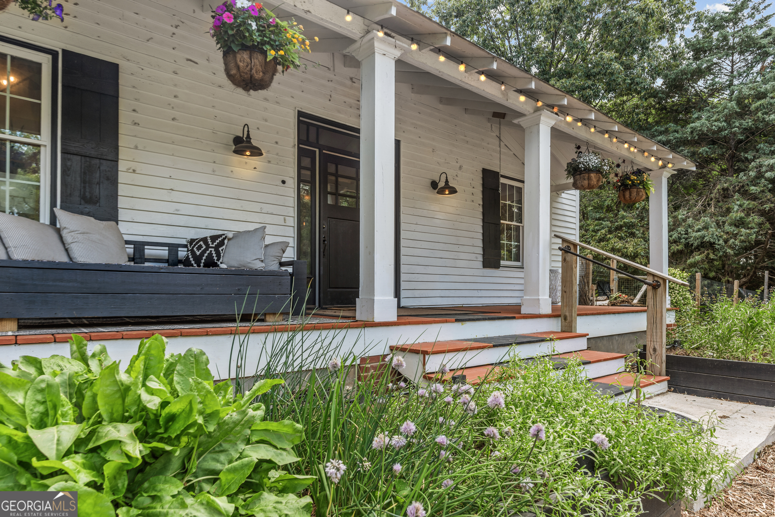 1580 Farmington Road Madison, GA 30650 - Photo 33 of 52 a view of a house with a small yard and a large window