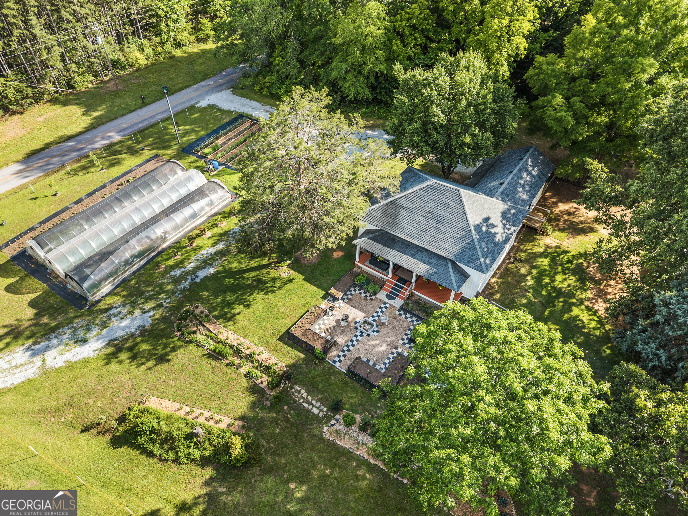 1580 Farmington Road Madison, GA 30650 - Photo 45 of 52 an aerial view of a house with a yard