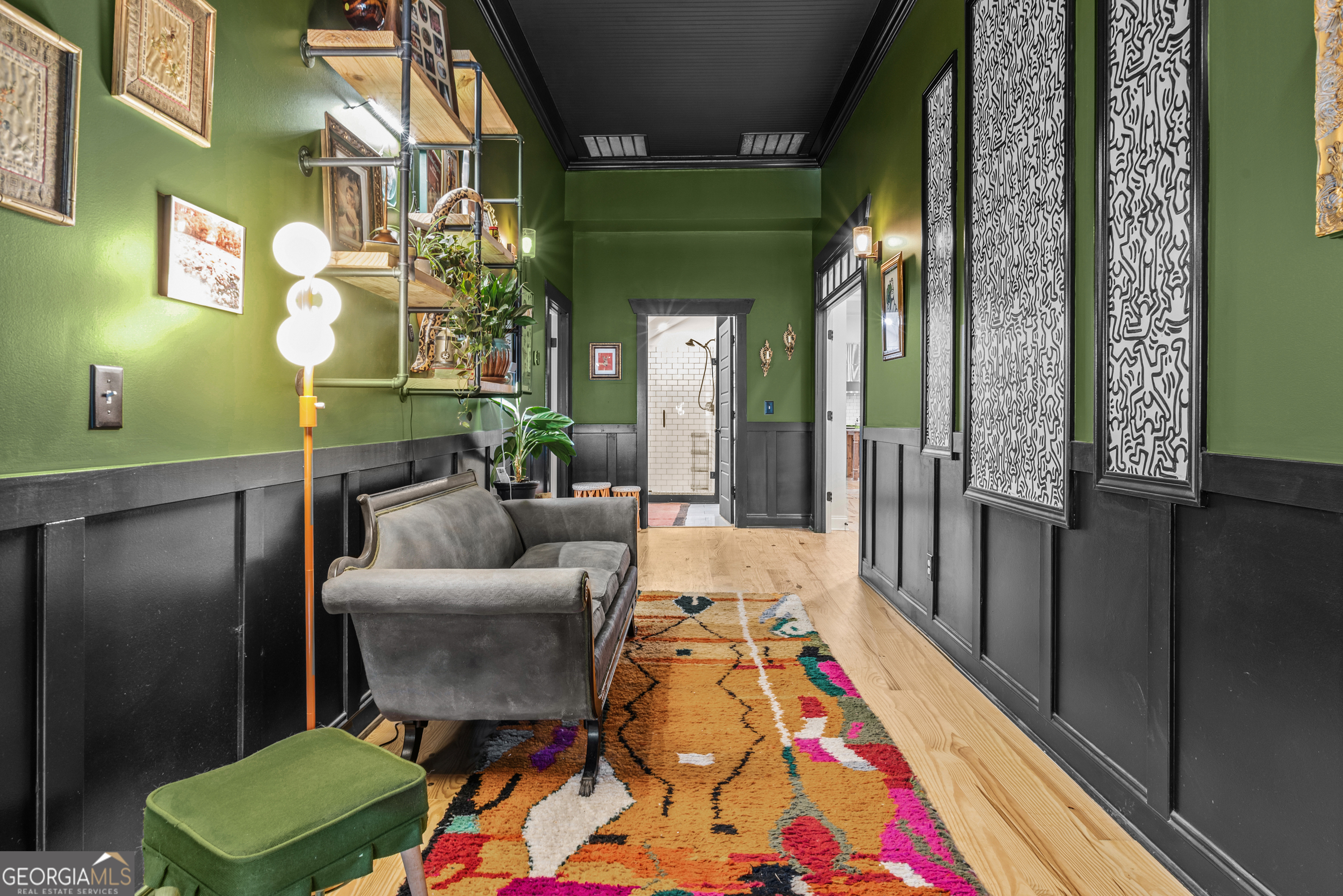 1580 Farmington Road Madison, GA 30650 - Photo 8 of 52 a living room with furniture and a baby crib