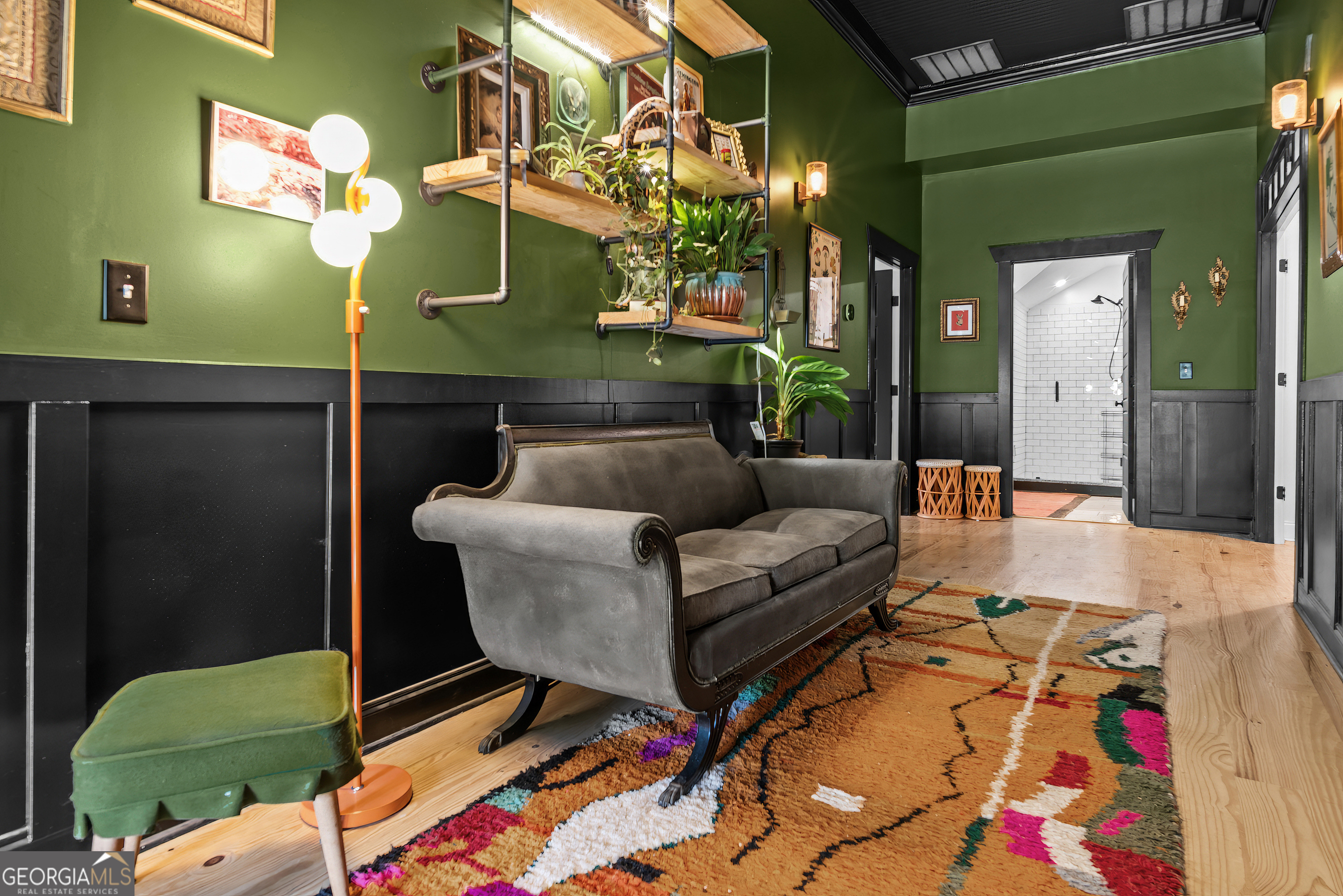 1580 Farmington Road Madison, GA 30650 - Photo 9 of 52 a living room with furniture and a dining table