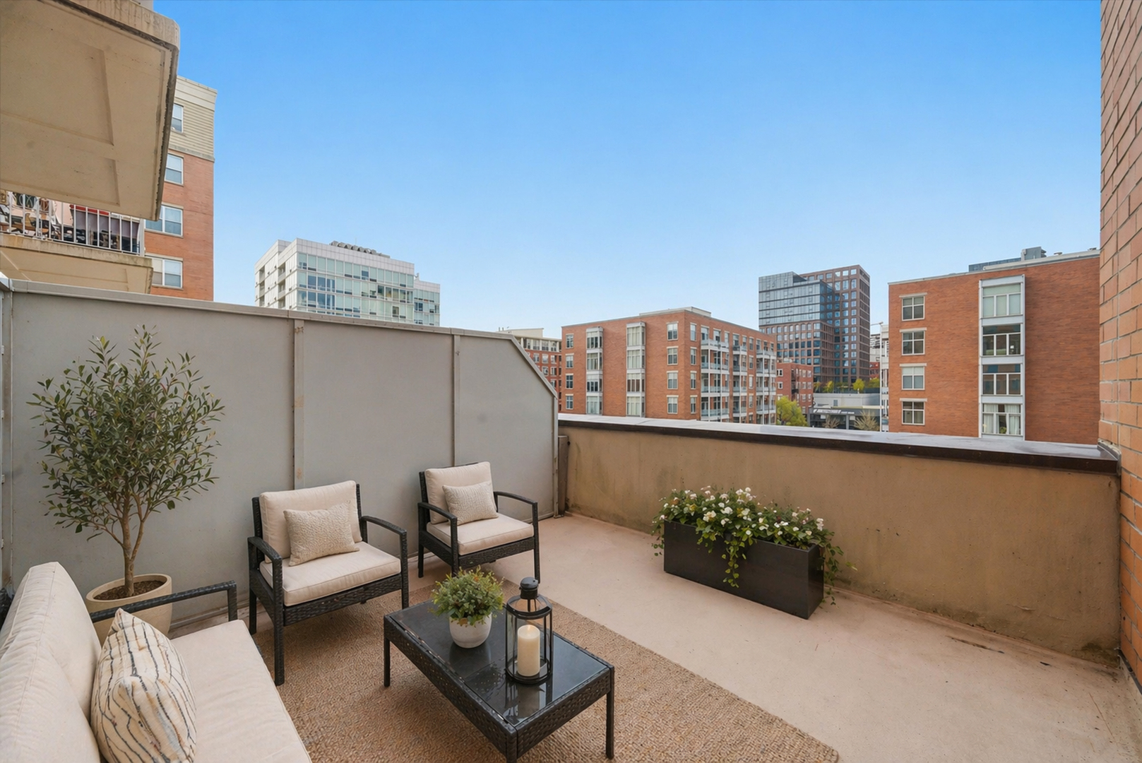 950 West Monroe Street, Unit 401 Chicago, IL 60607 - Photo 14 of 27 a roof deck with couches and potted plants