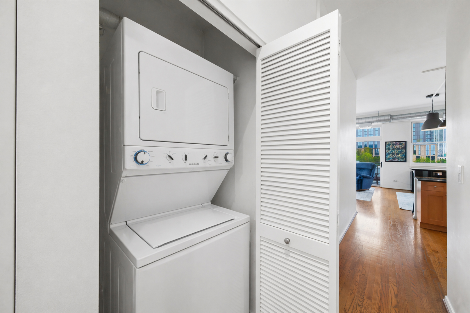 950 West Monroe Street, Unit 401 Chicago, IL 60607 - Photo 23 of 27 a view of washer and dryer with wooden floor