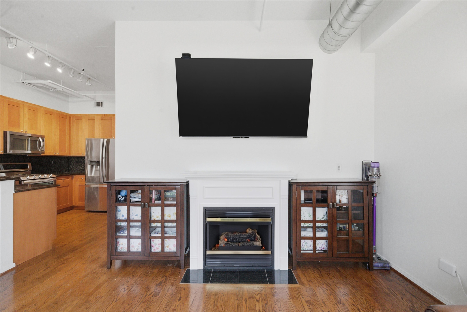 950 West Monroe Street, Unit 401 Chicago, IL 60607 - Photo 9 of 27 a living room with furniture and a fireplace