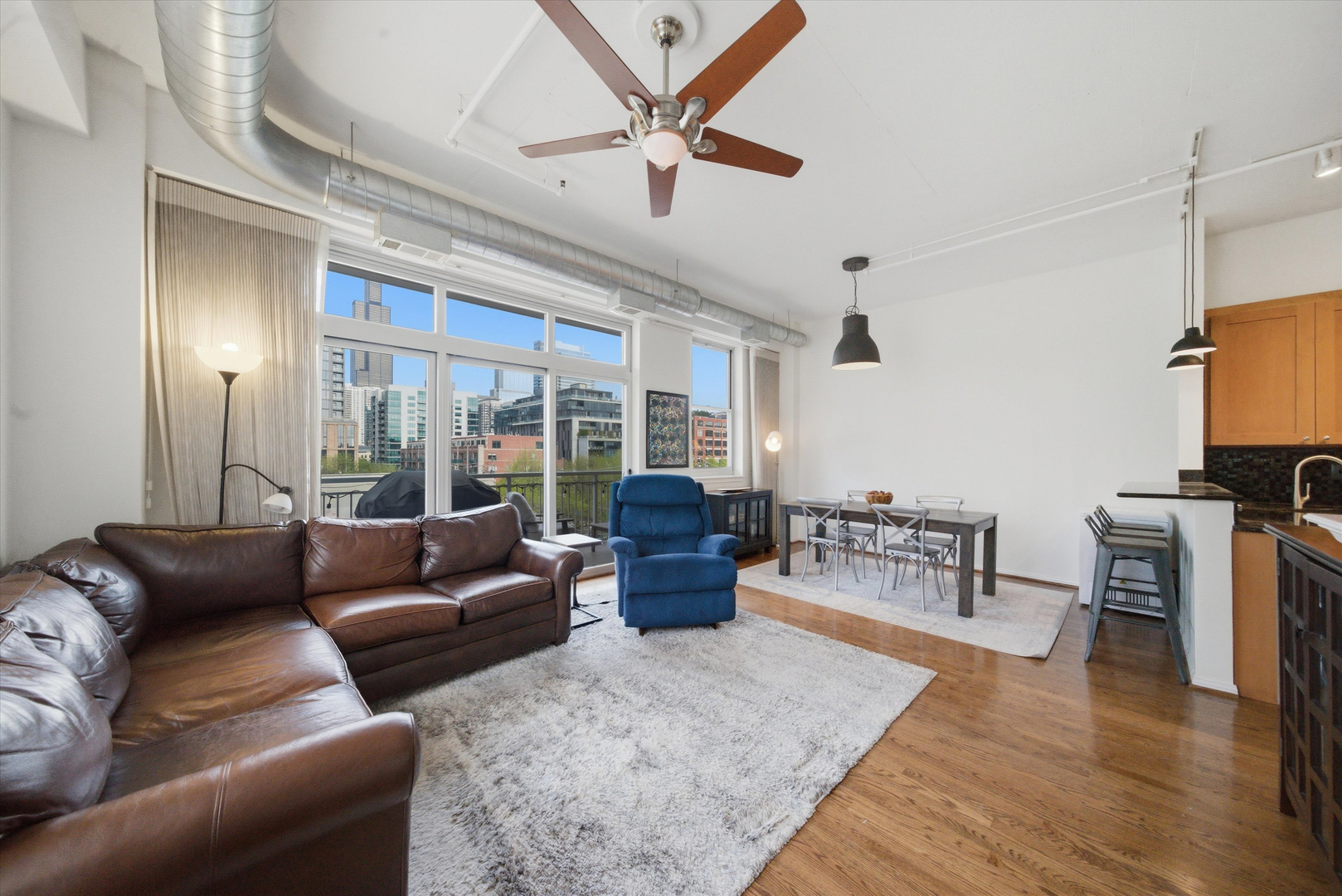 950 West Monroe Street, Unit 401 Chicago, IL 60607 - Photo 10 of 27 a living room with furniture and a large window