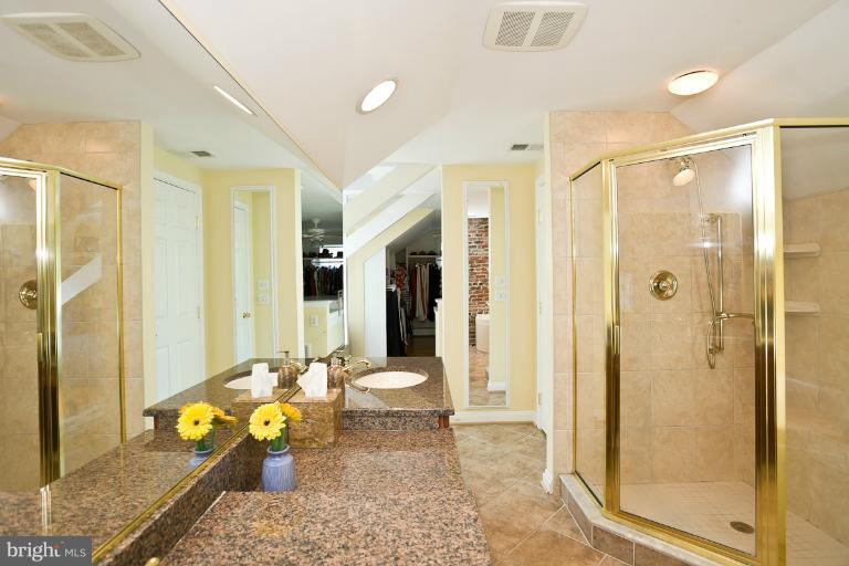 7014 Kenleigh Road Baltimore, MD 21212 - Photo 8 of 30 a bathroom with a granite countertop tub shower and mirror