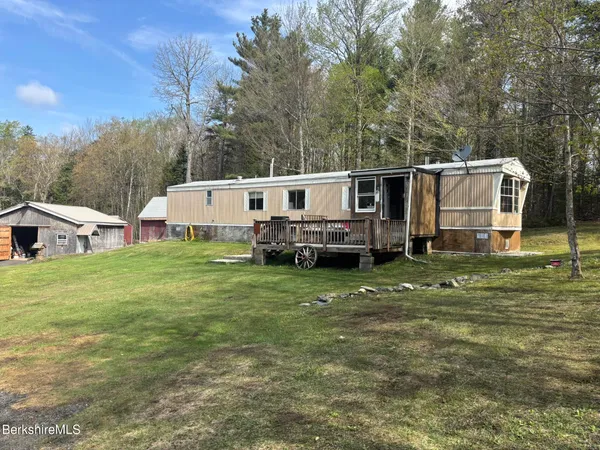 a utility house with car parked in front of it