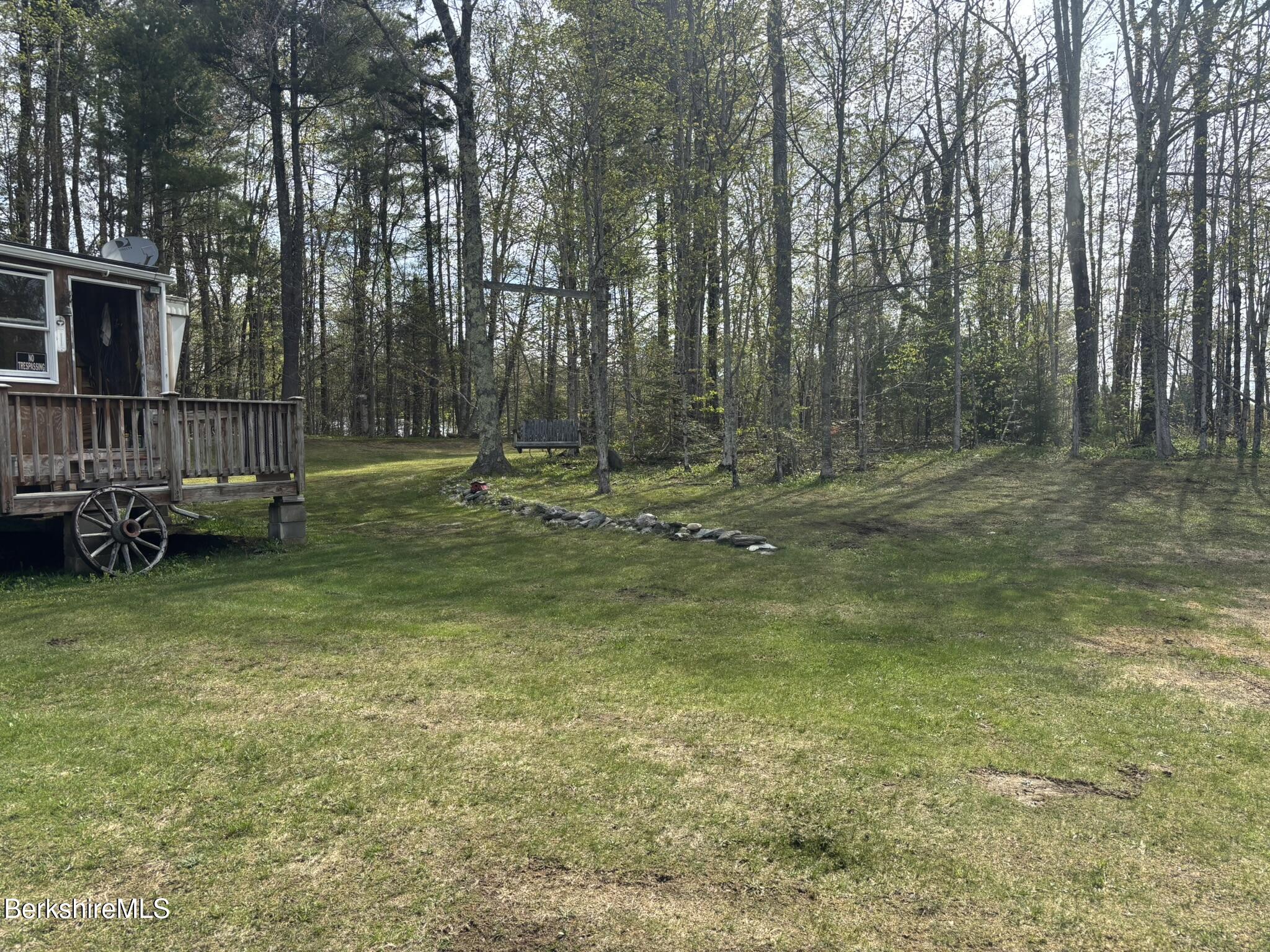 500 Loop Road Savoy, MA 01256 - Photo 14 of 27 a backyard of a house with lots of green space and deers