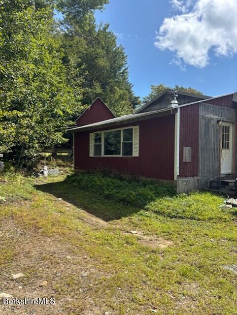 500 Loop Road Savoy, MA 01256 - Photo 24 of 27 a front view of a house with garden