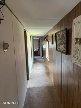 a view of gallery with wooden floor