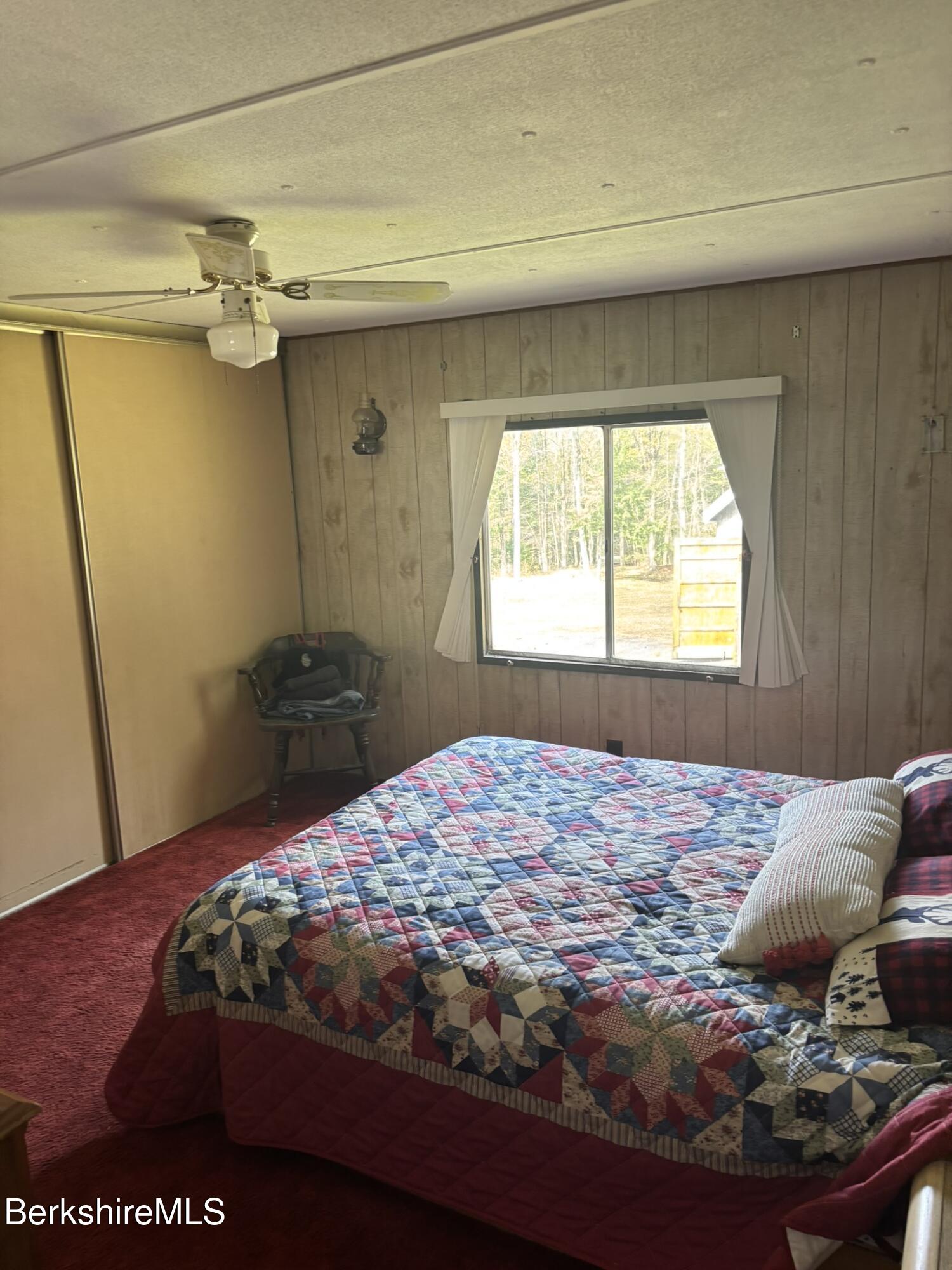500 Loop Road Savoy, MA 01256 - Photo 9 of 27 a bedroom with a bed and a window