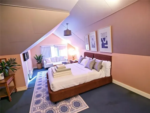 a bed room with a bed and a couch