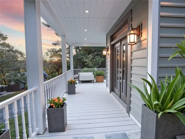 a porch with furniture and garden