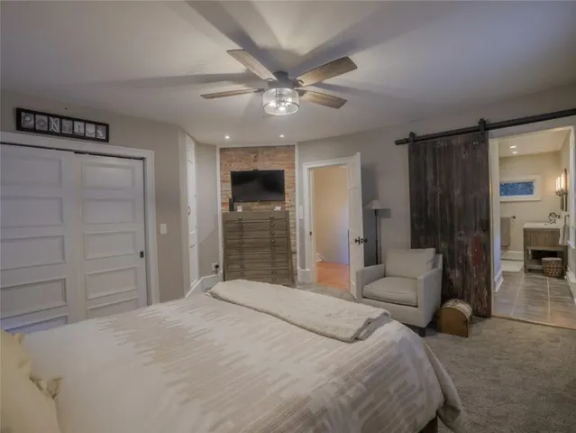 a bedroom with a bed and closet