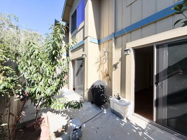 a view of a path along with potted plant and buildings