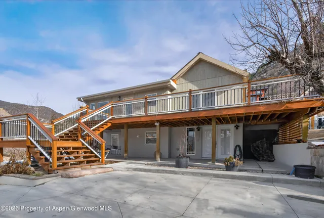 a view of a room with chairs and windows